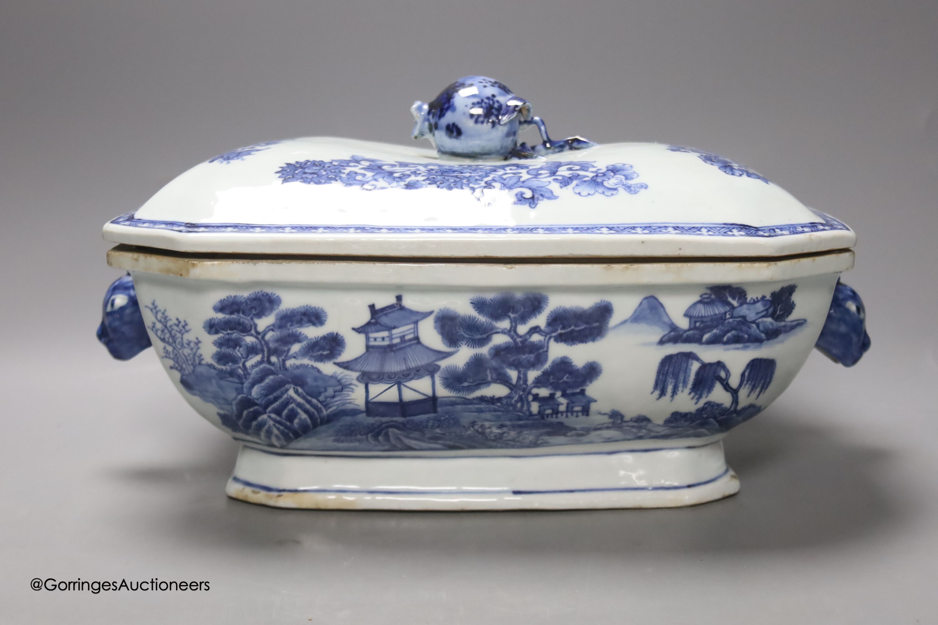 Two 18th century Chinese export blue and white lidded tureens, one lacking cover, 34cm